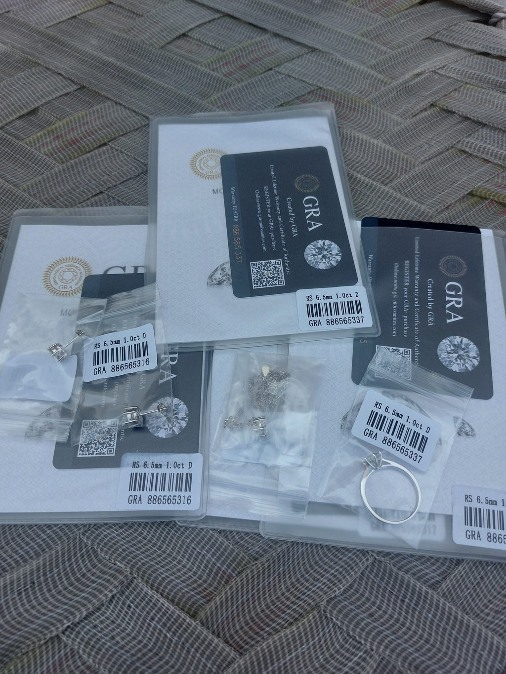 certified Moissanite 925 Sterling Silver Jewelry Set including ring, earrings, necklace, and pendant.