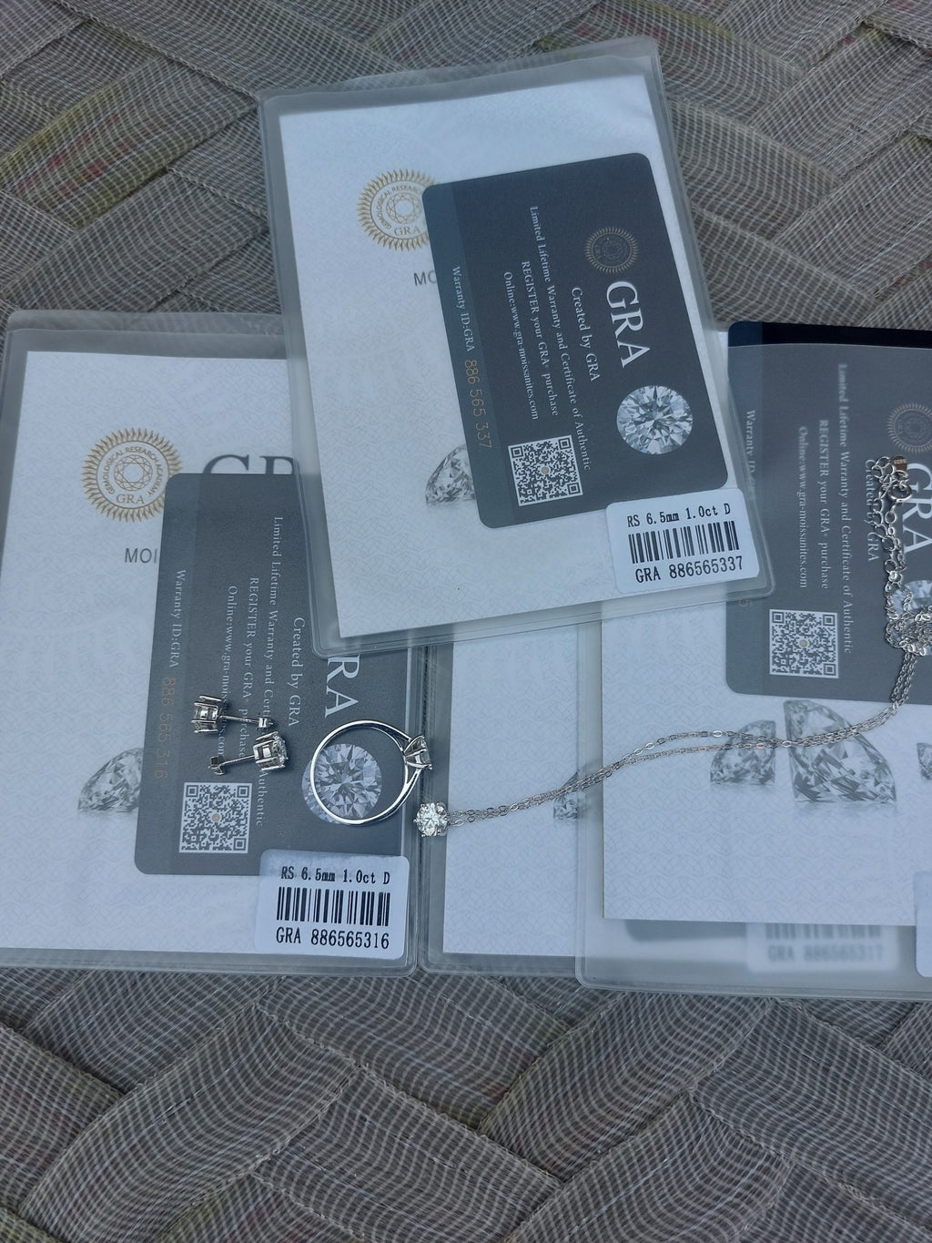 certified Moissanite 925 Sterling Silver Jewelry Set including ring, earrings, necklace, and pendant.