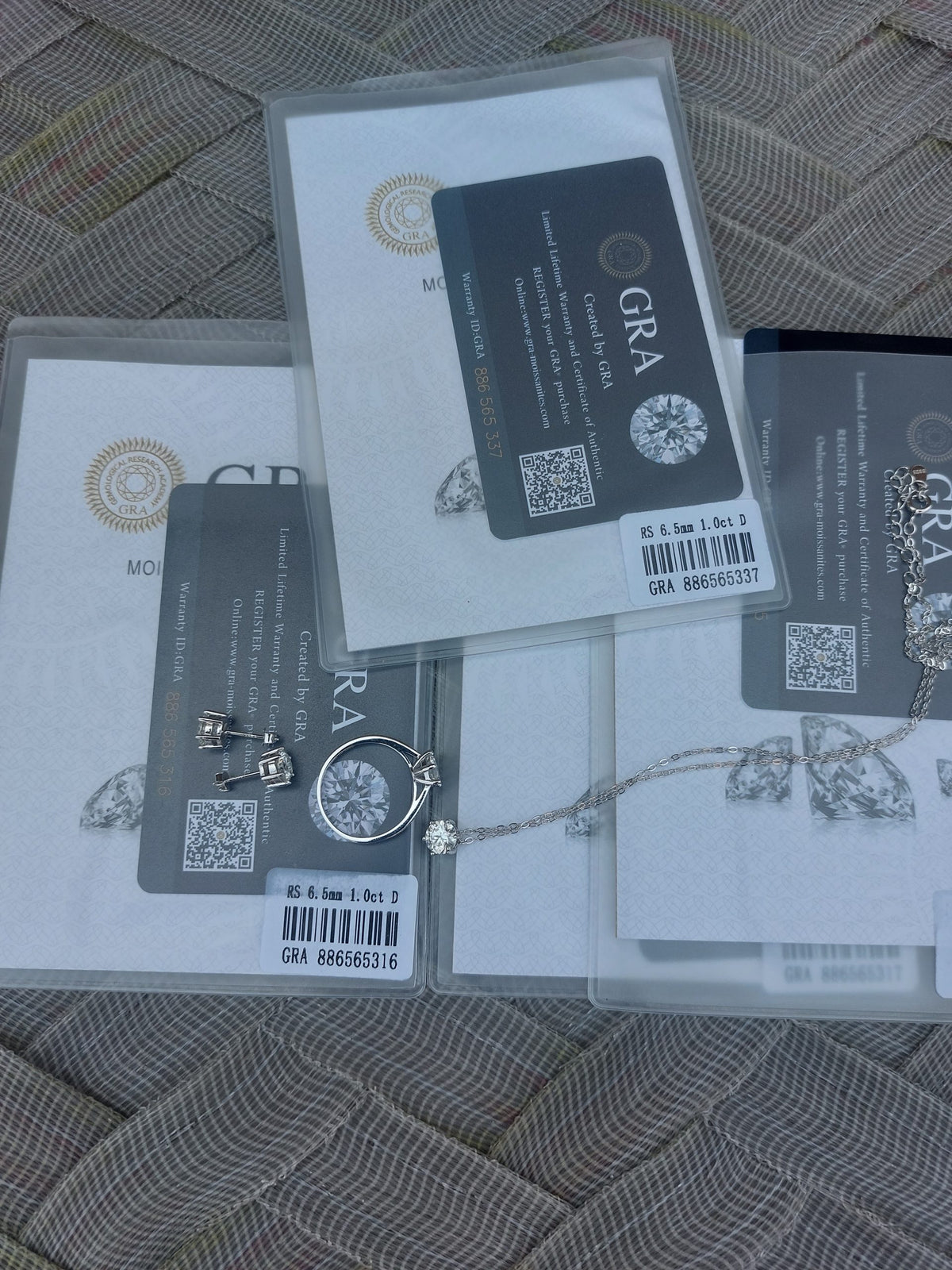 certified Moissanite 925 Sterling Silver Jewelry Set including ring, earrings, necklace, and pendant.
