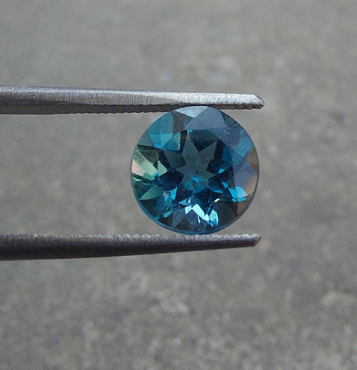 genuine London Blue Topaz 3 carat round brilliant cut gemstone with deep blue color and excellent clarity